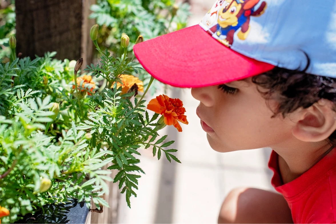 kid-smelling-a-flower