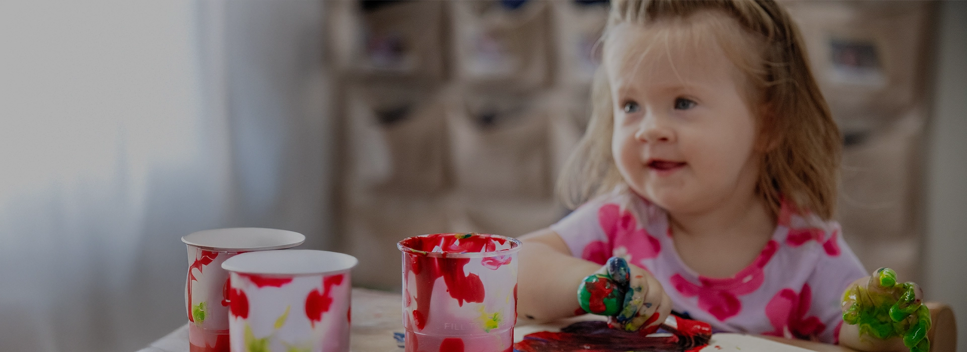 Child playing color paint
